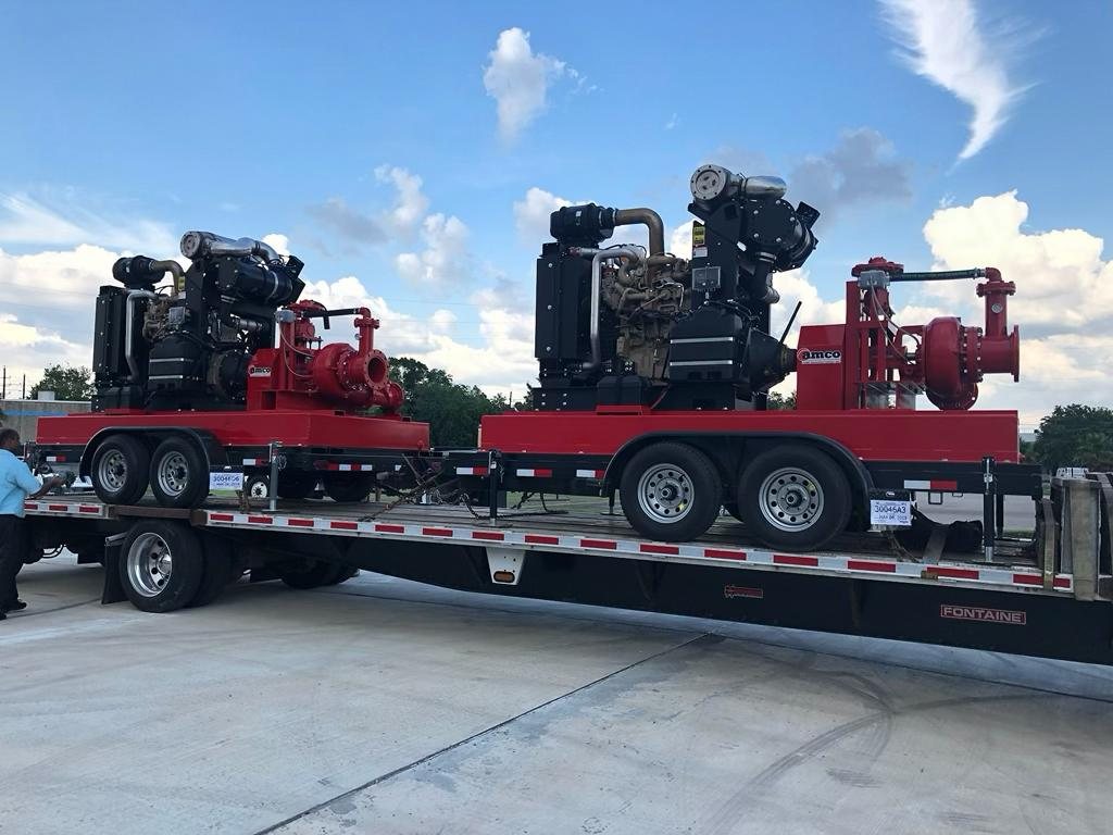 Two AMCO high head diesel pump packages loaded on a flatbed for shipment