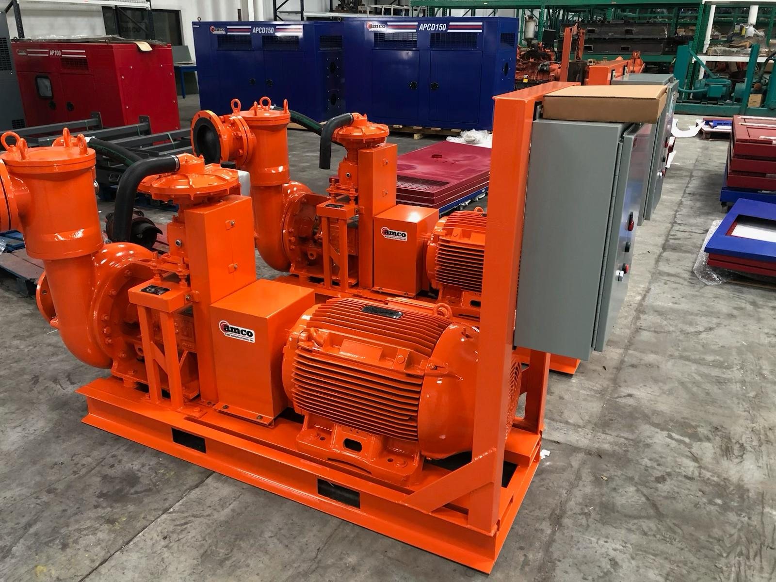 Orange electric-drive STP trash pump package with control panel built to customer spec