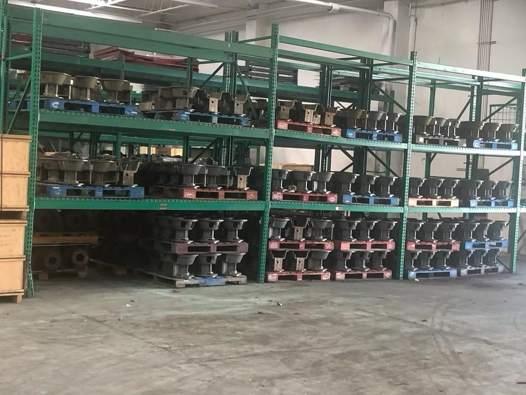 Warehouse shelving stocked with AMCO impellers, volutes and wear parts