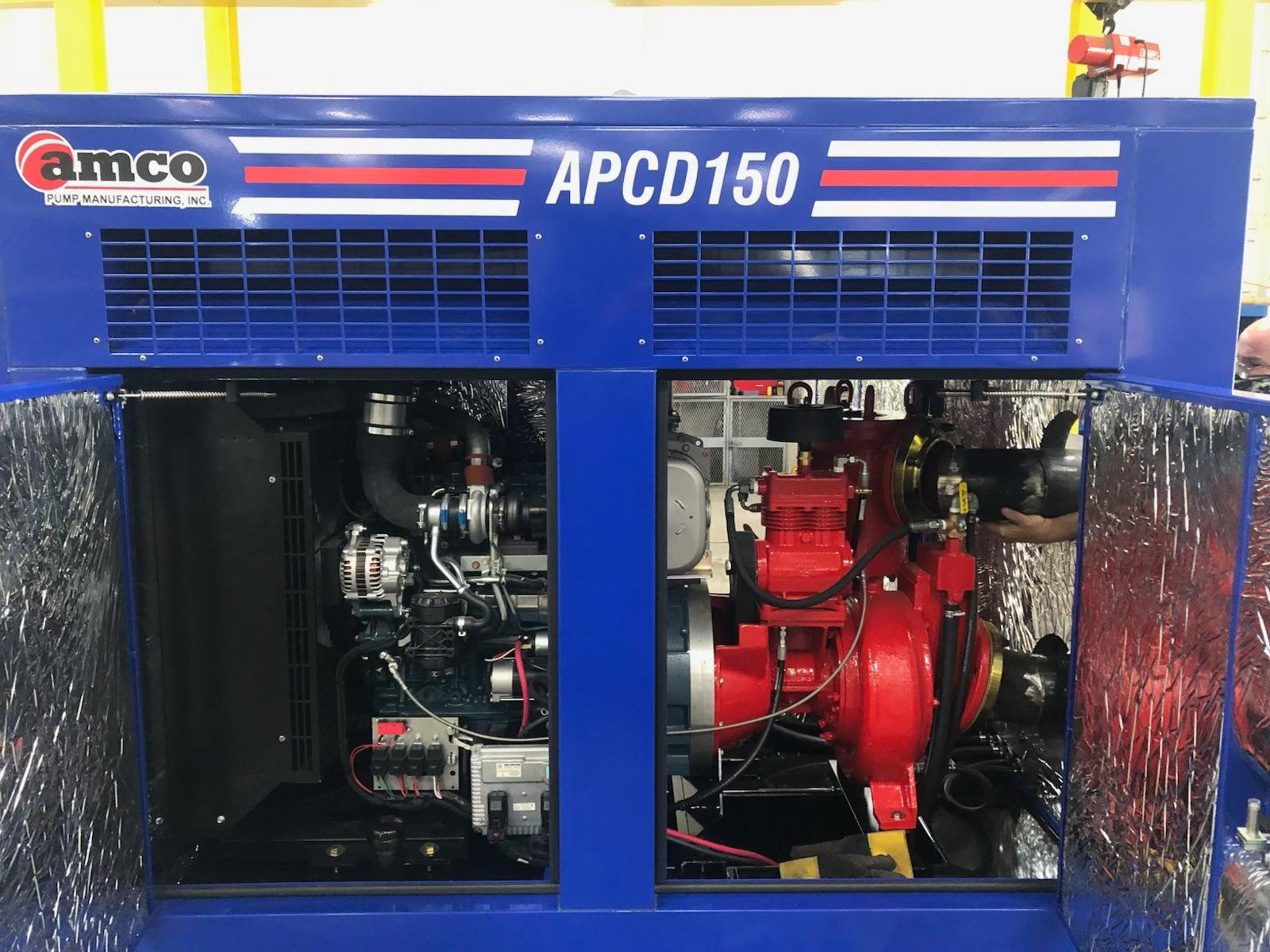 APCD150 sound-attenuated pump with enclosure doors open showing the AMCO red pump end
