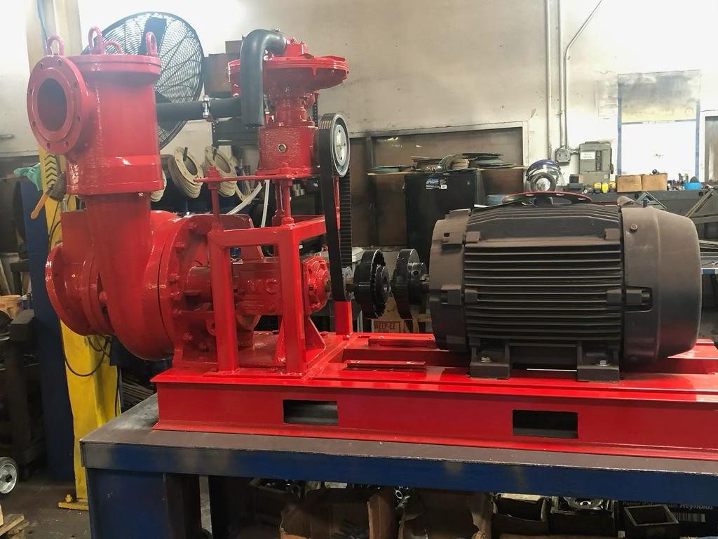 Electric drive utility trash pump mounted on a compact fabricated steel base