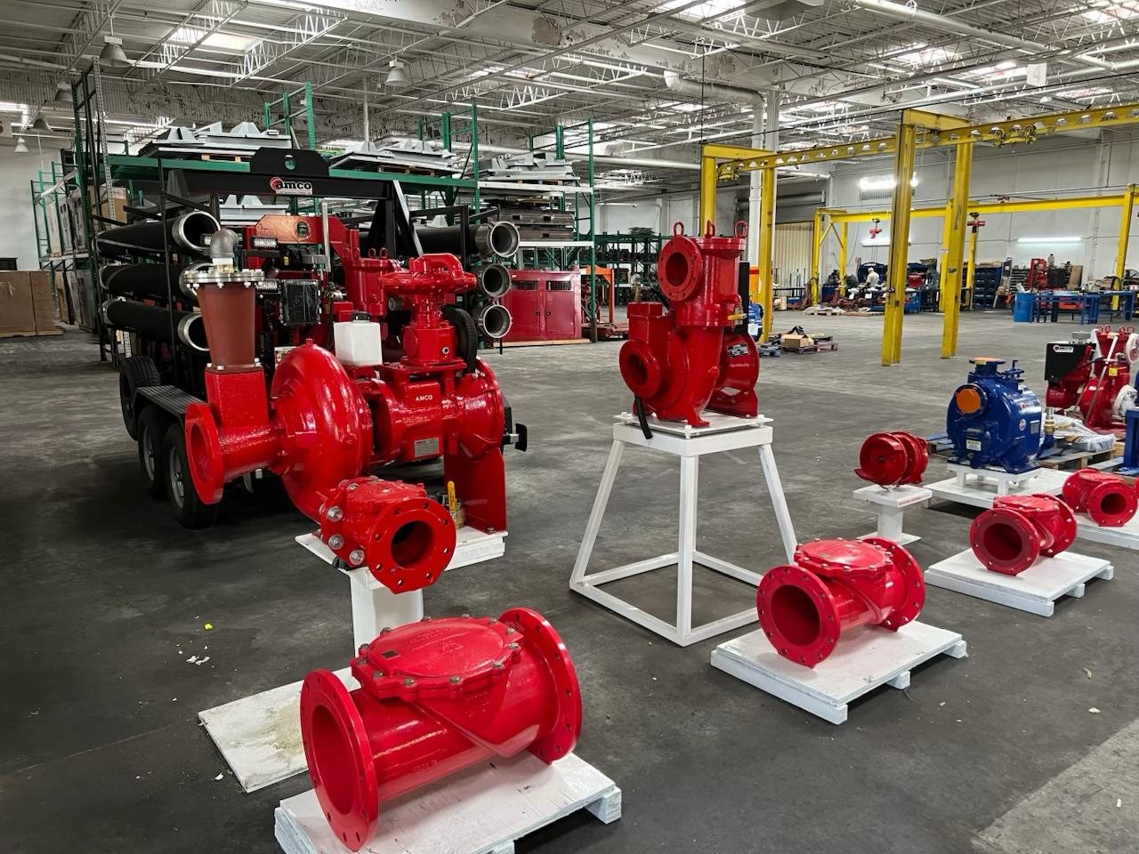 Utility trash pump volutes and quick-release covers finished in AMCO red